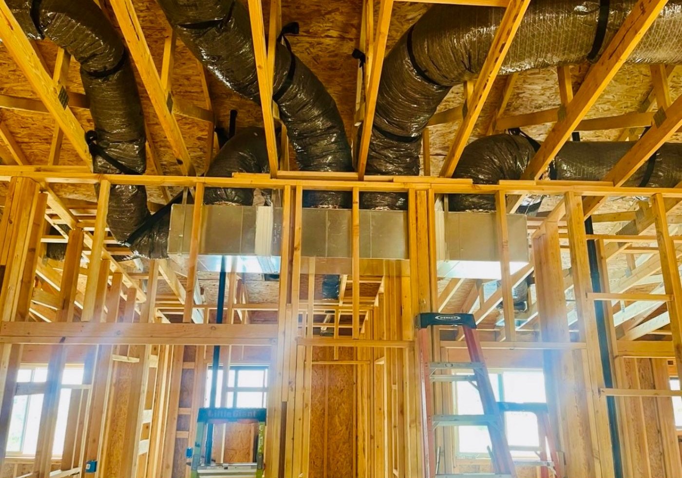 Insulated flex duct hung in open framing